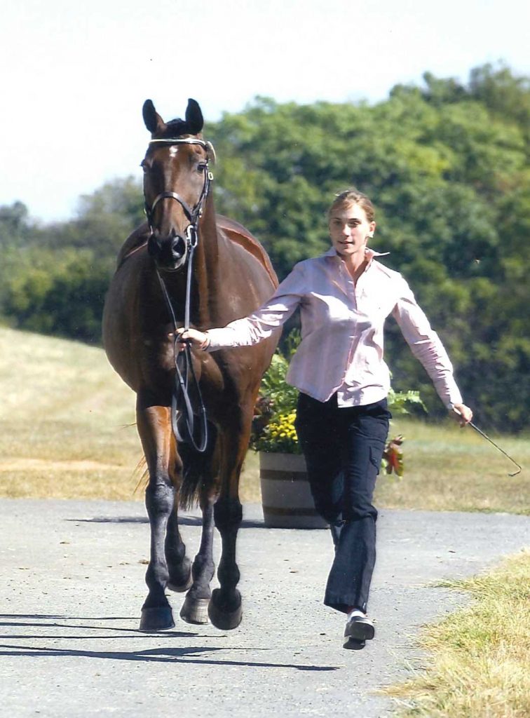 Christy jogging with a horse